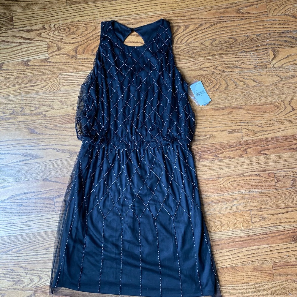 new w tags Black dress with beading.